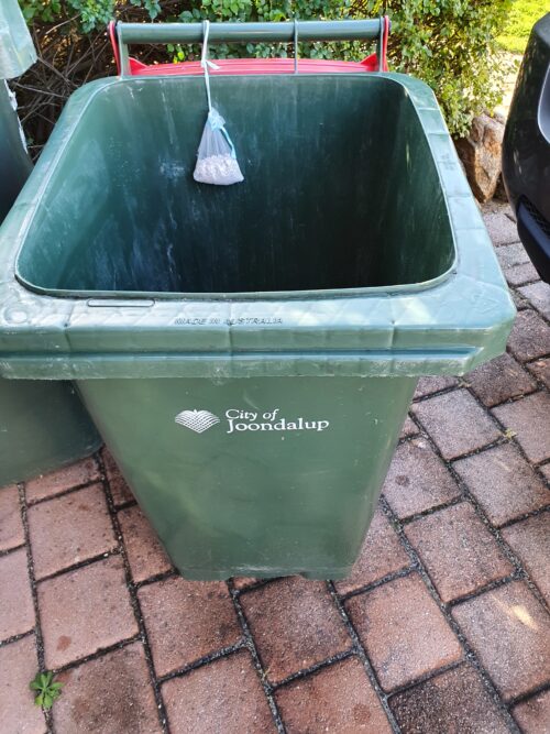 Bin Bombs in Organza Bag tied to handle on Wheelie Bin